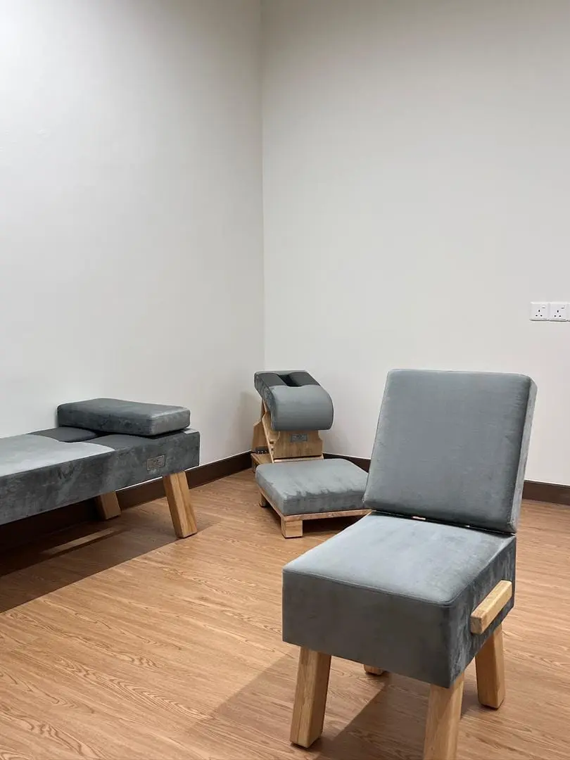 Private consultation room with seating and treatment benches